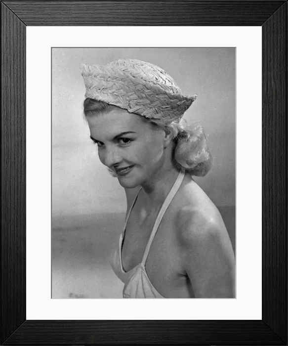 Framed Print : Woman wearing a bikini top and hat April 1953 P017644