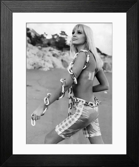 Framed Print : Beach-Wear Fashions: Swimsuit designer Jean Voigt thinks that back views have been too