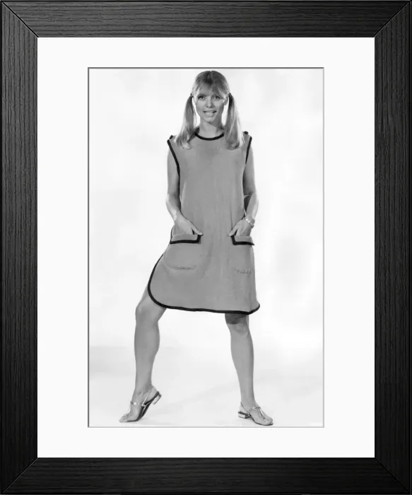 Framed Print : Colourful and easy to wear and a winner every time. Woman wearing a beach shift for Framed Print : Colourful and easy to wear and a winner every time. Woman wearing a beach shift for