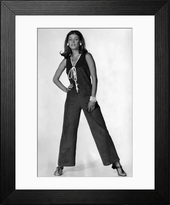 Framed Print : Bright blue towelling jumpsuit, trimmed with white at the V-neck