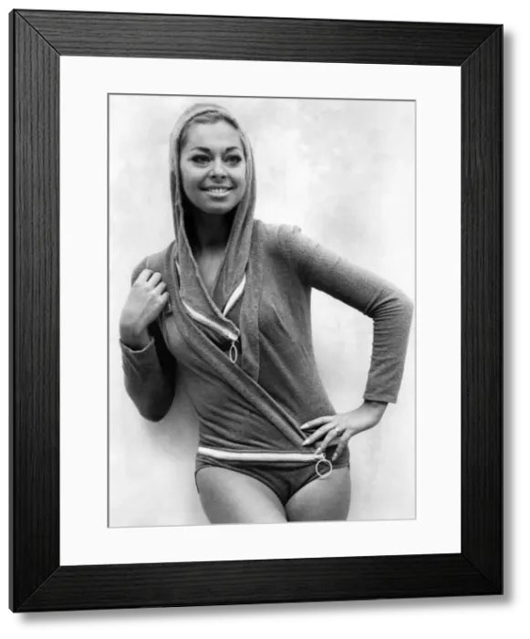 Framed Print : Actress Joan Crane was modelling a four-piece zip up swimsuit an stretch fabric by