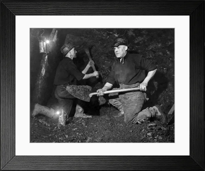 Framed Print : Two brothers working their own colliery have been given the task of bewing a two-ton lump Framed Print : Two brothers working their own colliery have been given the task of bewing a two-ton lump