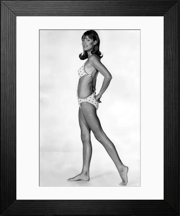Framed Print : Sun-spotted in orange on pale gold, this swimsuit by Jersea of Sweden has deep cut-aways