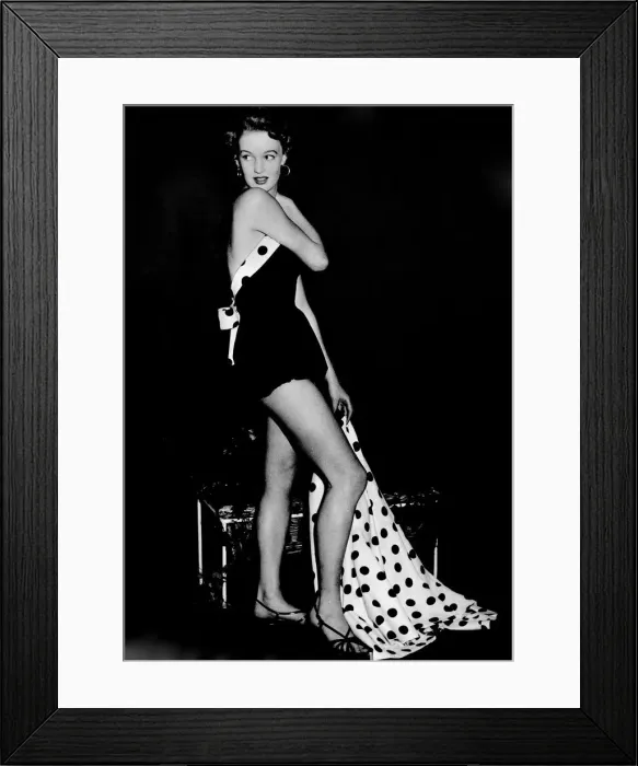 Framed Print : Black and white spot cotton. A beach suit in black cotton pique trimmed with black spots Framed Print : Black and white spot cotton. A beach suit in black cotton pique trimmed with black spots