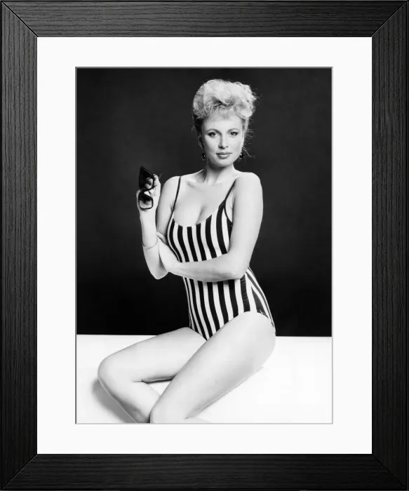Framed Print : Fashion - Beachwear: Star in stripes. You can tell its the middle of winter