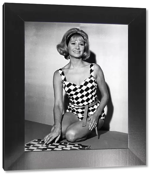 Helen Curtis wears a black and white harlequin swimsuit