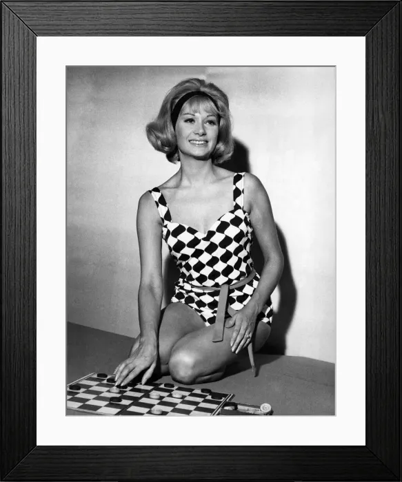 Framed Print : Helen Curtis wears a black and white harlequin swimsuit