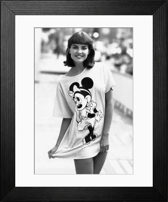 Framed Print : The style is unmistakeable - demure dress, hair bow and white gloves Framed Print : The style is unmistakeable - demure dress, hair bow and white gloves