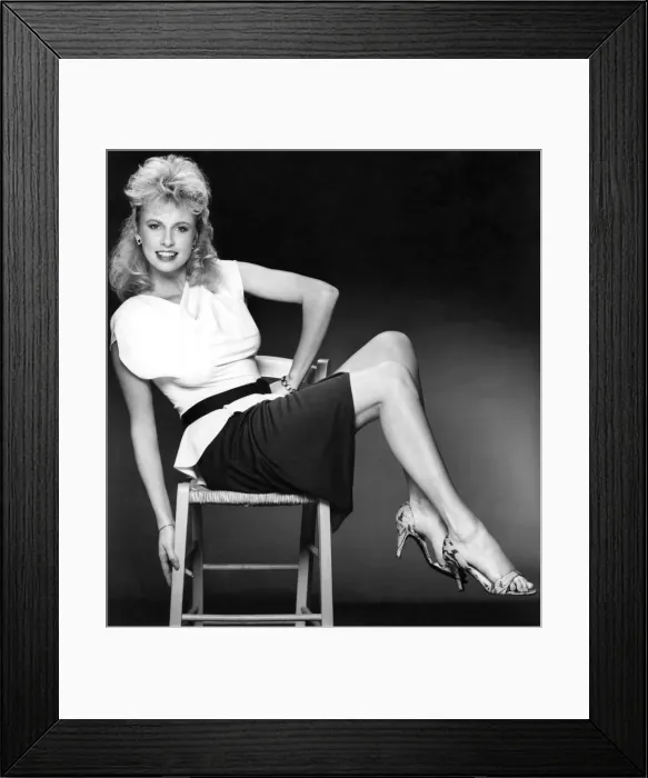 Framed Print : Model Angie in a figure-hugging white peplum top. January 1984 P017391 Framed Print : Model Angie in a figure-hugging white peplum top. January 1984 P017391