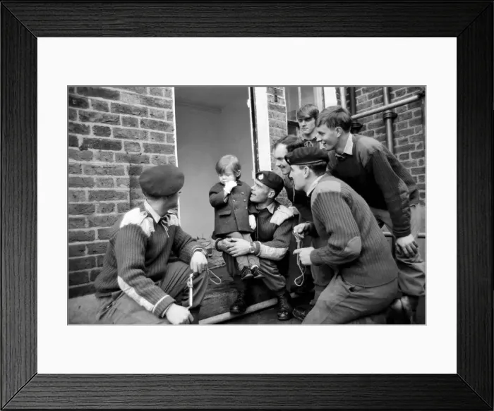 Framed Print : Mark Diment meets the six marines who are working on his special play area
