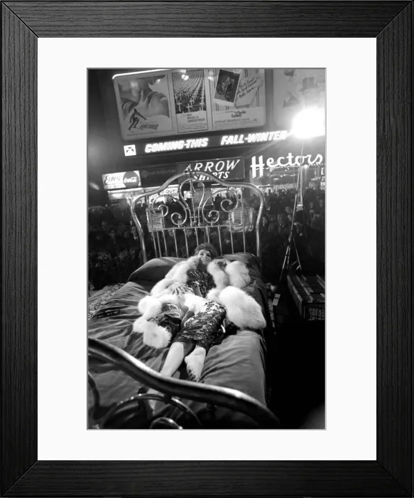 Framed Print : Actress Julie Newmar lying on a brass bed in New York Framed Print : Actress Julie Newmar lying on a brass bed in New York