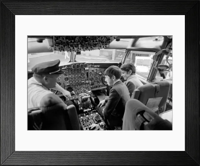 Framed Print : Children Transport Aviation. Children looking at the controls of a TWA 707 plane in Framed Print : Children Transport Aviation. Children looking at the controls of a TWA 707 plane in