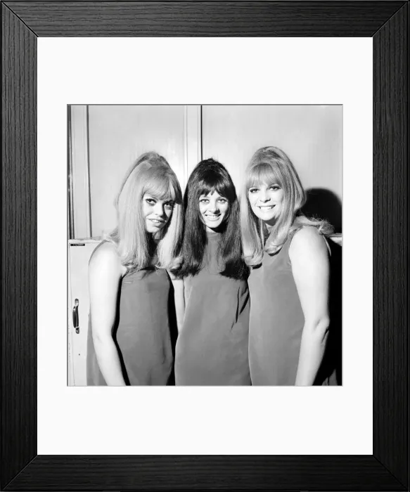 Framed Print : People Women: Three girls wearing mini dresses smile into the camera