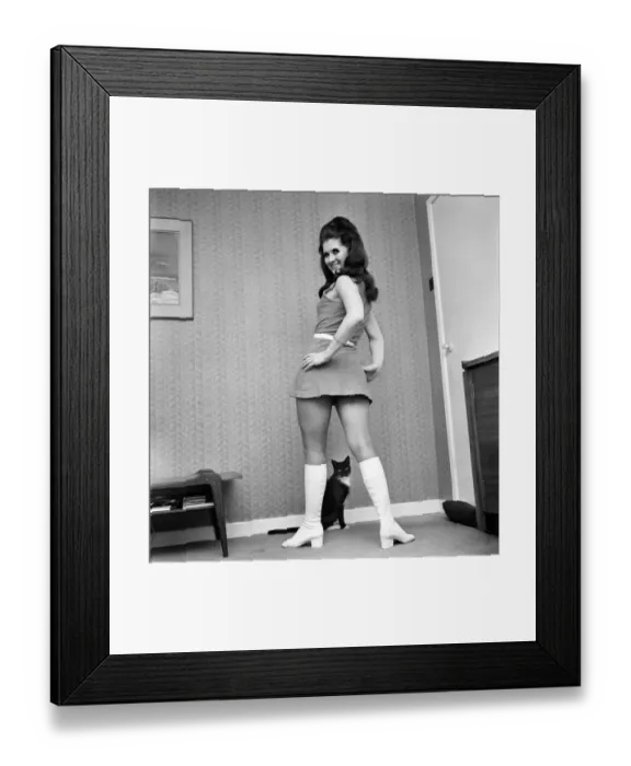 Framed Print : Fashion Clothing: A woman posing in her home weaving a mini dress