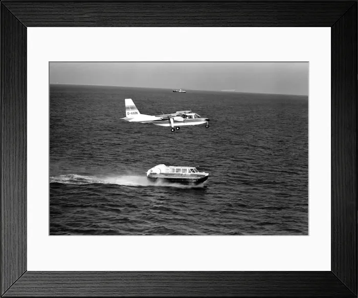 Framed Print : IslanderO aircraft flies over Cushion Craft Hovercraft, off the Isle of Wight Framed Print : IslanderO aircraft flies over Cushion Craft Hovercraft, off the Isle of Wight