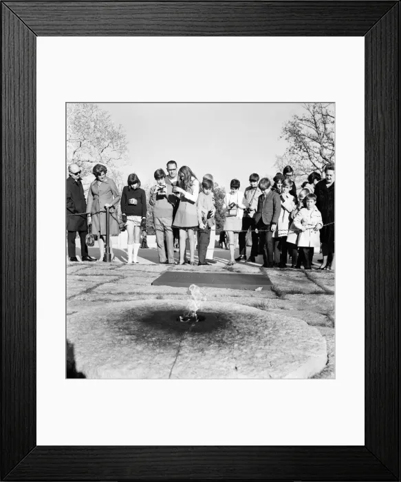 Framed Print : Tourists with their cameras observe the eternal flame at the grave of slain American