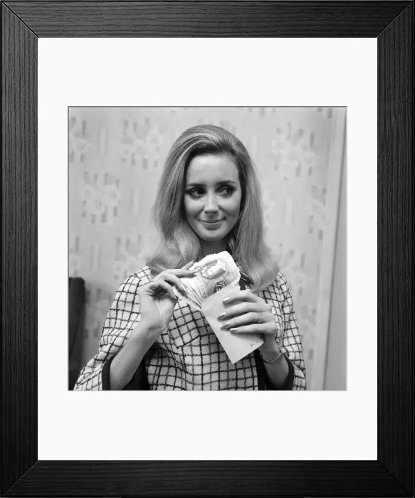 Framed Print : Woman counting her money. November 1969 Z11174 Framed Print : Woman counting her money. November 1969 Z11174