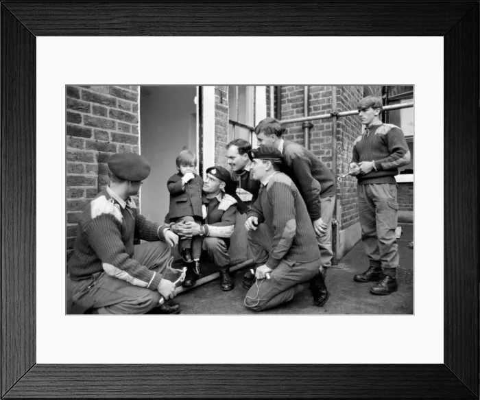 Framed Print : Mark Diment meets the six marines who are working on his special play area