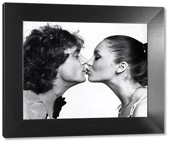 Peter Powell from Radio One and Model Geraldine seen here kissing for Daily Mirror