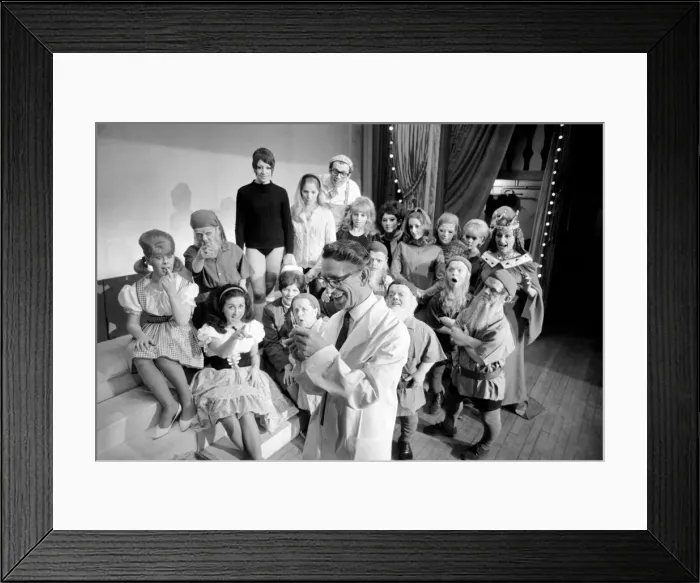 Framed Print : A doctor with his syringe makes ready to give anti-flu vaccine to Margaret Ayre Framed Print : A doctor with his syringe makes ready to give anti-flu vaccine to Margaret Ayre