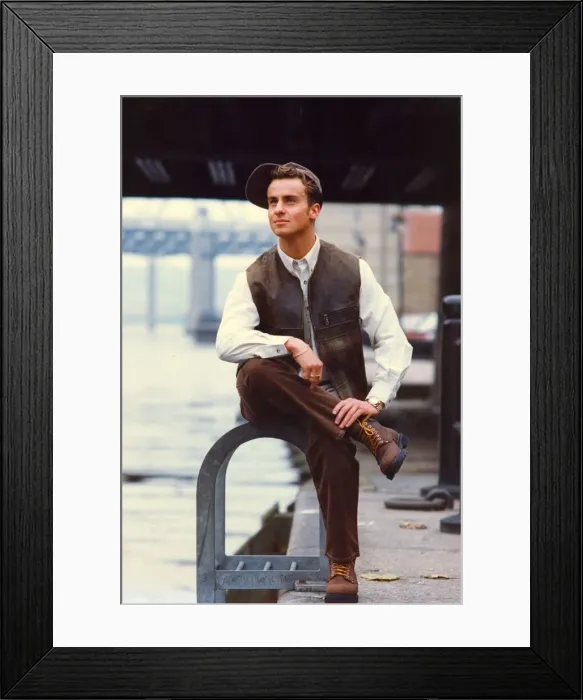 Framed Print : A young man posing in the latest styles