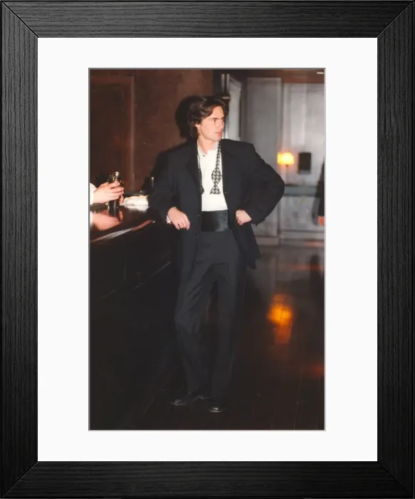 Framed Print : A young man posing in the latest suit waiting for his date to show up Framed Print : A young man posing in the latest suit waiting for his date to show up