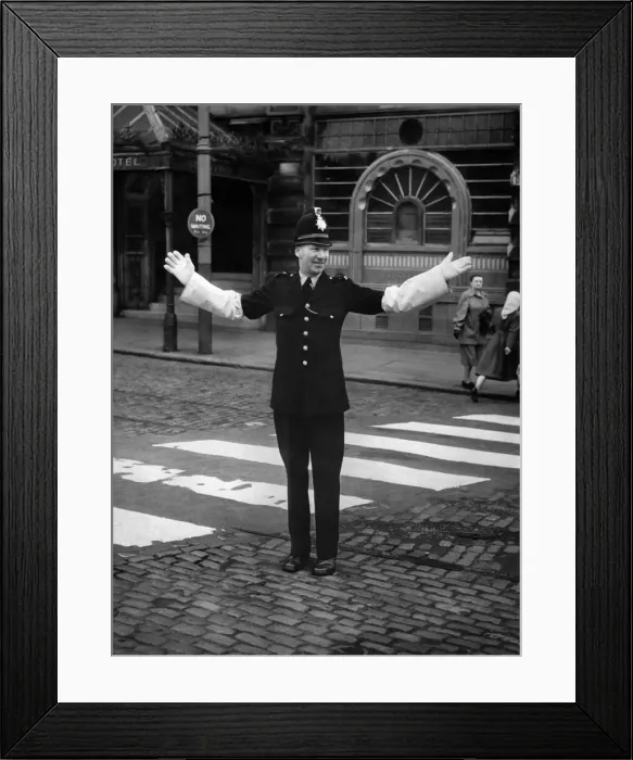 Framed Print : P. C. Gibbs of the Manchester Police seen here on crossing patrol on the day he retires Framed Print : P. C. Gibbs of the Manchester Police seen here on crossing patrol on the day he retires