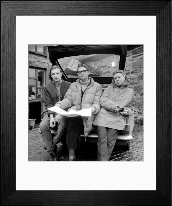 Framed Print : Three friends reading a map for an attempt to climb Mount Snowdonia in Wales Framed Print : Three friends reading a map for an attempt to climb Mount Snowdonia in Wales