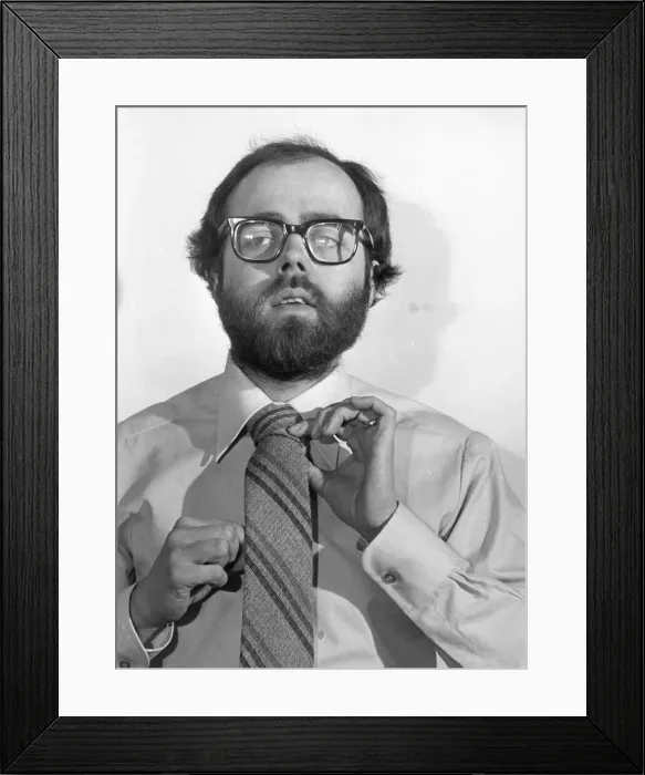 Framed Print : A young man getting to grips with the modern tie 01 / 09 / 78 circa Framed Print : A young man getting to grips with the modern tie 01 / 09 / 78 circa