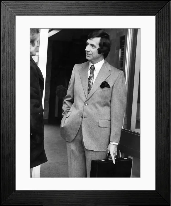 Framed Print : A man posing in a new suit from the Jonathan Hutton range with the latest in sideburns Framed Print : A man posing in a new suit from the Jonathan Hutton range with the latest in sideburns