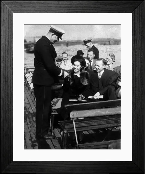 Framed Print : Conductor taking fares on The Thames river bus service at the begining of the blitz