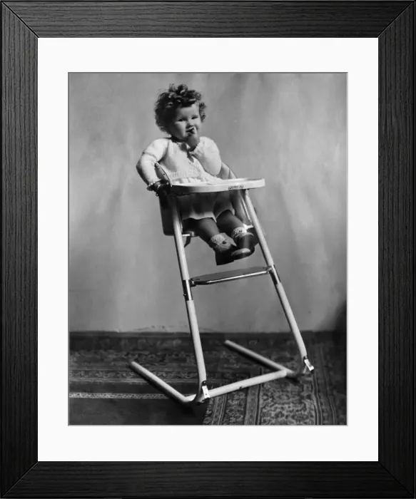 Framed Print : The new streamlinee baby high chair. The chair cannot tip over in either position Framed Print : The new streamlinee baby high chair. The chair cannot tip over in either position