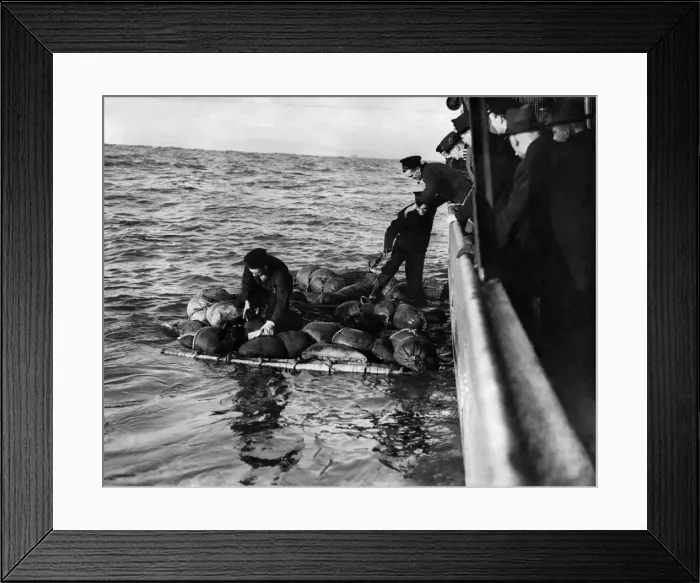 Framed Print : British Seamen rescued from raft following a U-boat attack on a North Atlantic Convoy Framed Print : British Seamen rescued from raft following a U-boat attack on a North Atlantic Convoy