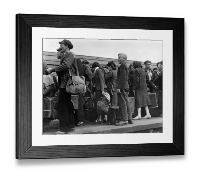 Framed Print : French civilians seen here arriving in a London railway station from Normandy Framed Print : French civilians seen here arriving in a London railway station from Normandy