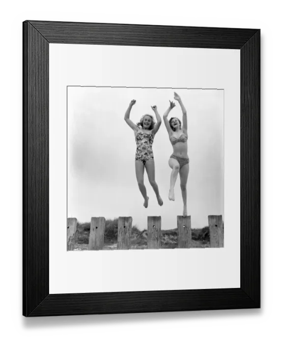 Framed Print : Shirley Eaton and Shirley Burniston seen here modelling a bikini and all in one Swim suit Framed Print : Shirley Eaton and Shirley Burniston seen here modelling a bikini and all in one Swim suit