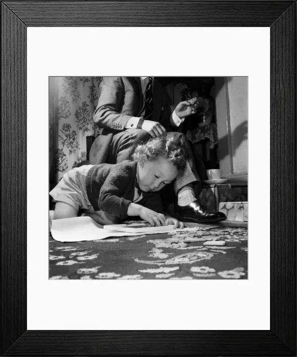 Framed Print : Alan Goldshaker aged 3 making up his jigsaw puzzles. October 1953 D5977