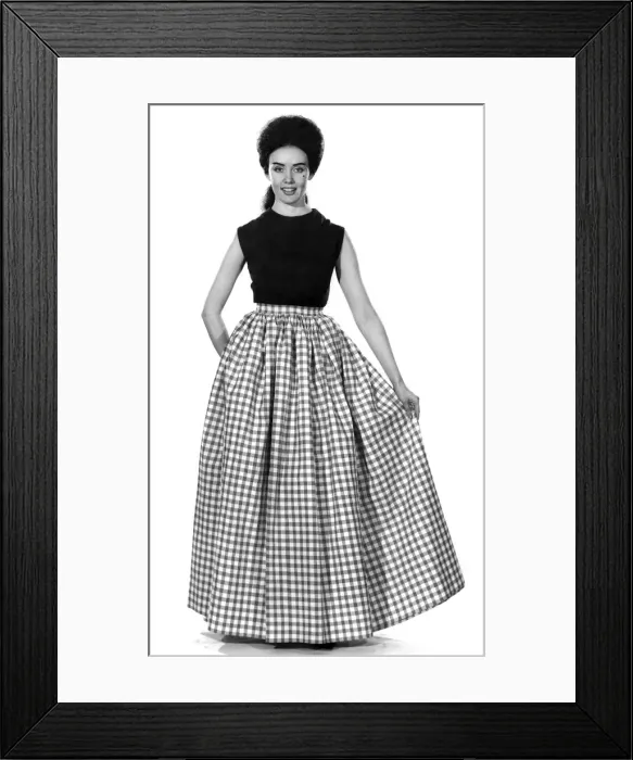 Framed Print : Reveille fashions 1962: Barbara wearing her two aprons together Framed Print : Reveille fashions 1962: Barbara wearing her two aprons together