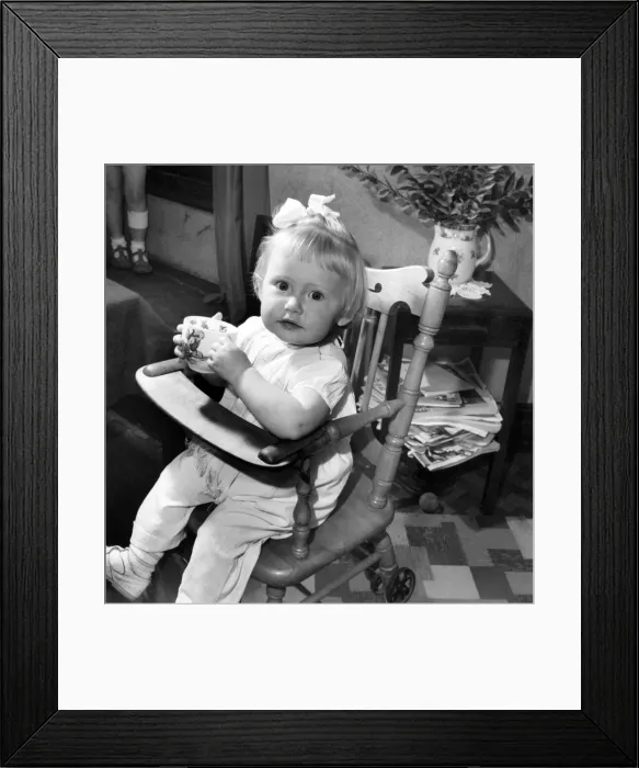 Framed Print : Small girl enjoying a cup of tea. August 1953 D5235-001 Framed Print : Small girl enjoying a cup of tea. August 1953 D5235-001