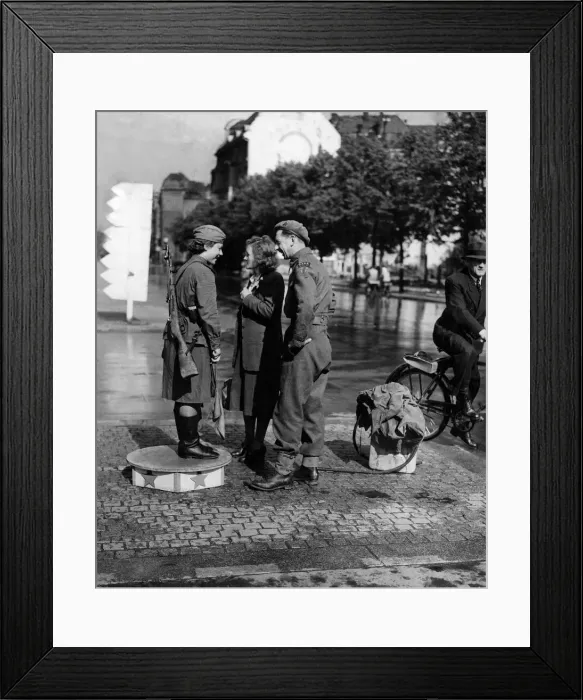 Framed Print : A Soviet Army girl on traffic duty in the Unter den Linden in Berlin chats with a British
