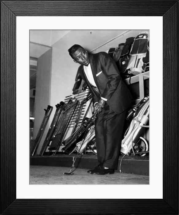 Framed Print : Joey Brown tries out golf clubs at a big London departmental store (Selfridges)