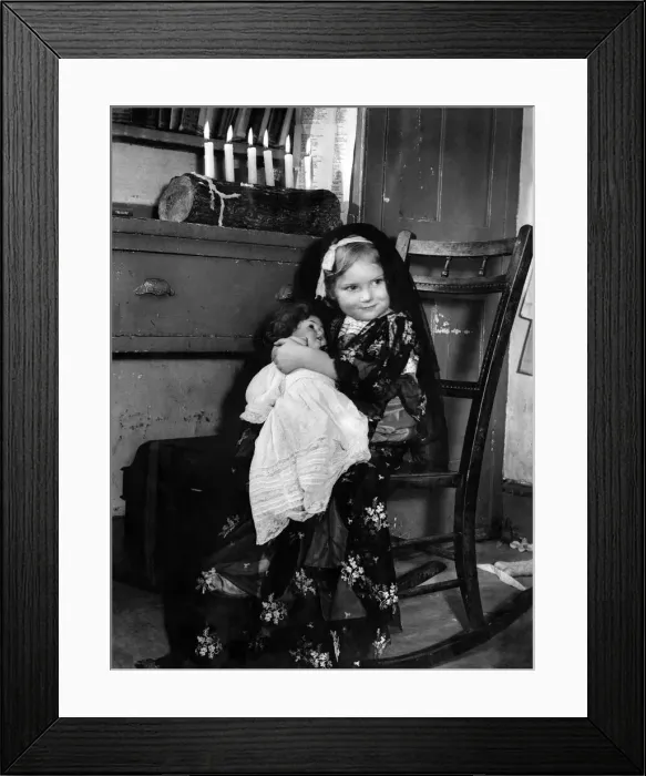 Framed Print : 2 years old Mother'with her own baby doll tucked into her arm Framed Print : 2 years old Mother'with her own baby doll tucked into her arm