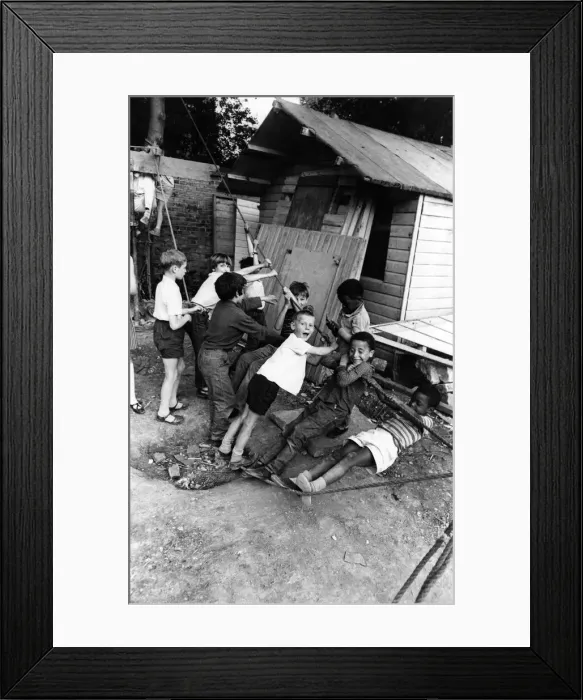 Framed Print : Children playing at an adventure playground in Peckham Road, Southwark