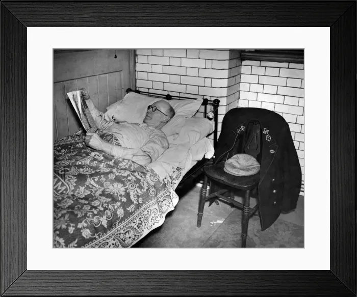 Framed Print : Guard Monagan of Carlisle settles down to a well earned rest after a tiring run from