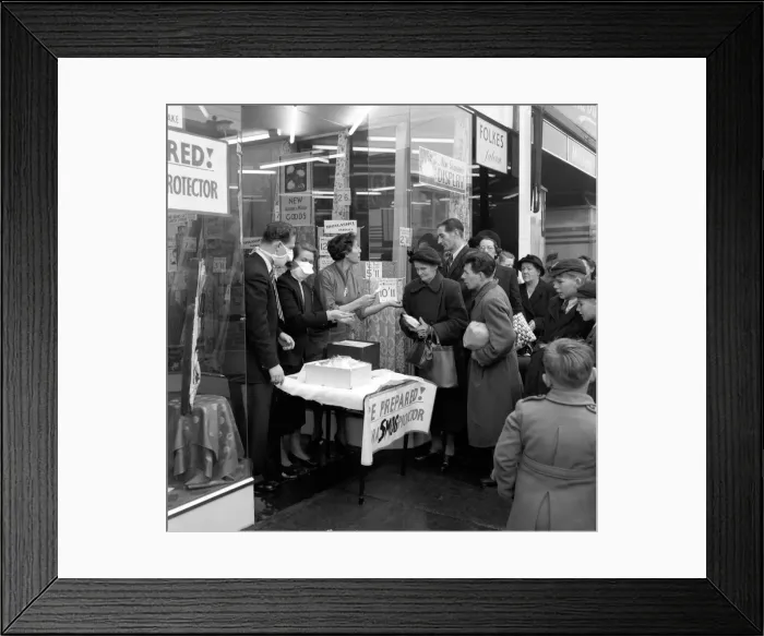 Framed Print : Selling Smog Mask in London. January 1953 D6497 Framed Print : Selling Smog Mask in London. January 1953 D6497