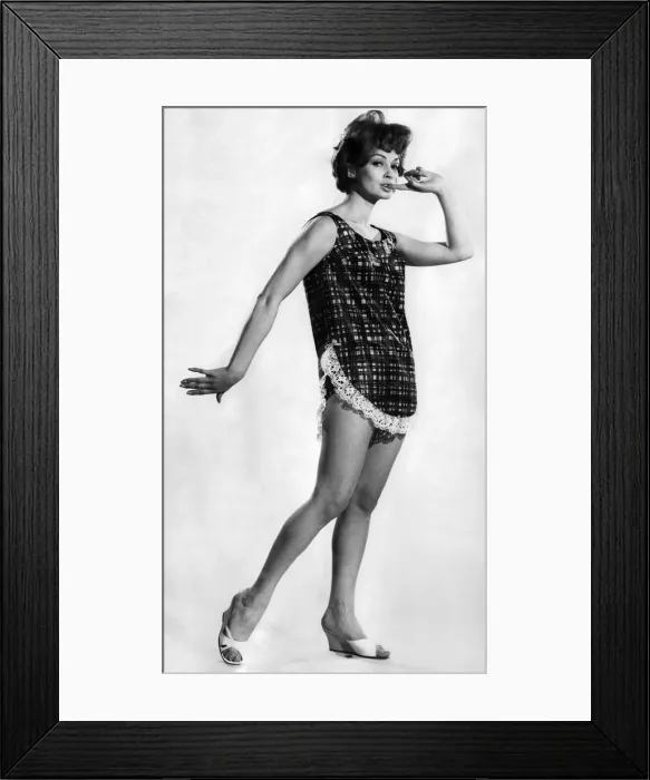 Framed Print : Model Suzy Kendall wearing an unusual swimming costume with apron style frontage