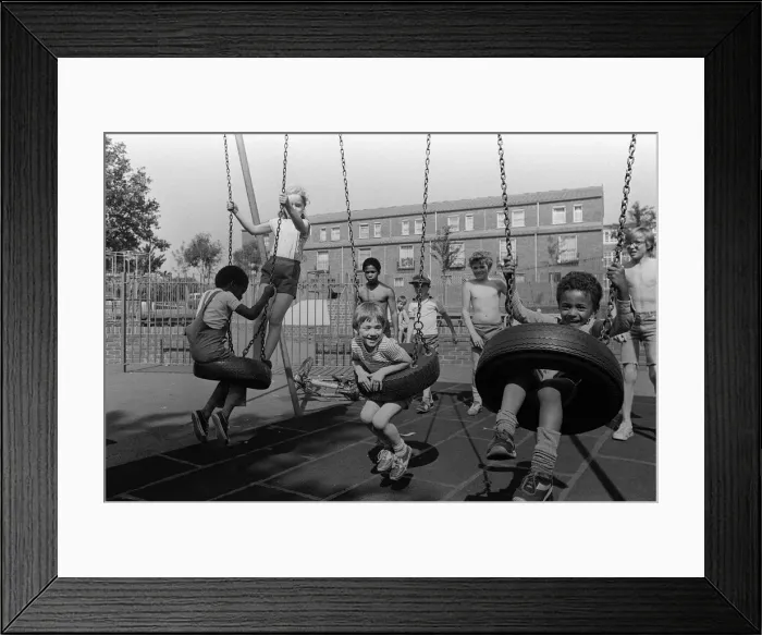 Framed Print : Notting Hill Carnival August 1981 Children playing on the swings in the recreation Framed Print : Notting Hill Carnival August 1981 Children playing on the swings in the recreation