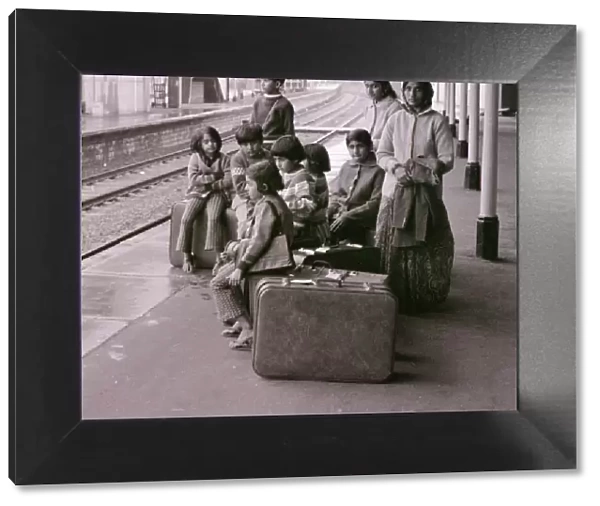 Asian family waiting at Bishops Stortford station, intending to travel to London