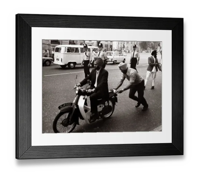 Framed Print : A Sikh man riding a motorcycle, wearing a turban. pushes by a fellow sikh Framed Print : A Sikh man riding a motorcycle, wearing a turban. pushes by a fellow sikh
