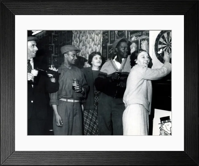 Framed Print : A game of darts at The Local The Cambridge. Watched by Syd Rhule