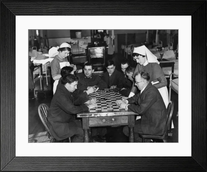 Framed Print : Sister Shine (right) and nurse Cockin playing cards with a group of boys in blue Framed Print : Sister Shine (right) and nurse Cockin playing cards with a group of boys in blue